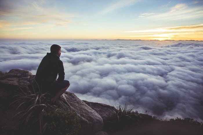 a man on the top of the hill