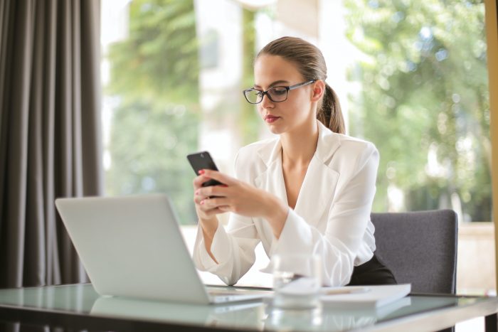 A healthcare worker texting a colleague