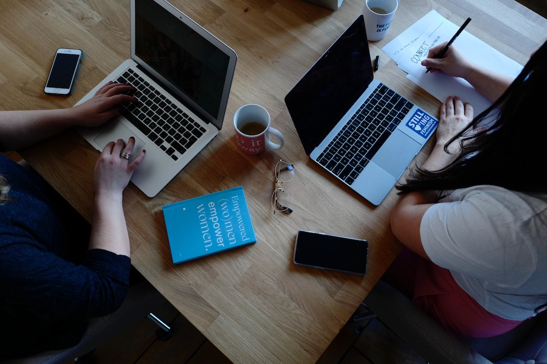 Colleagues browsing the internet for Notion alternatives