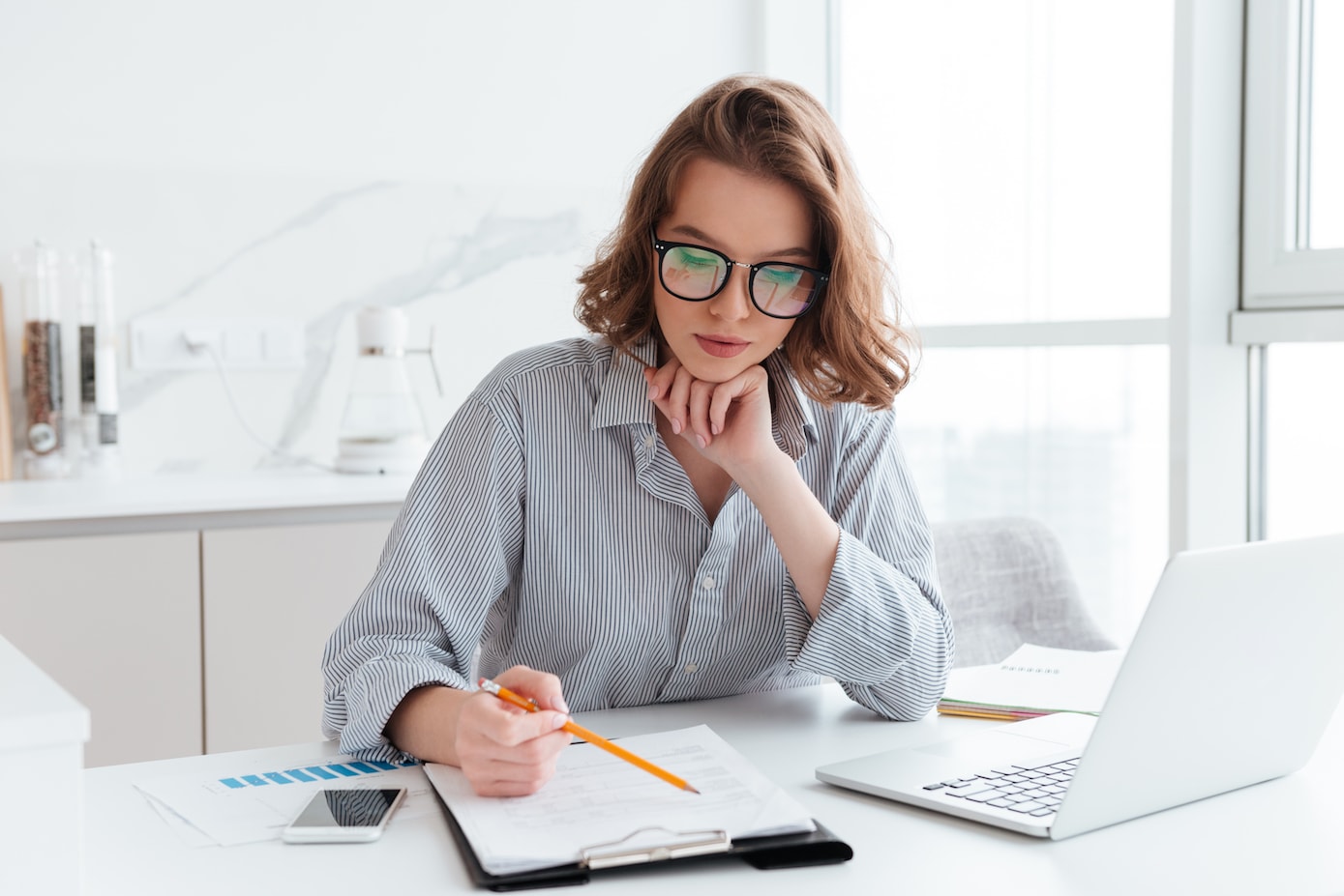 A small business owner working on expense tracking