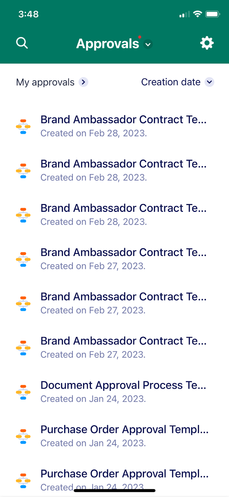 An image of a person using their mobile device to manage approval workflows