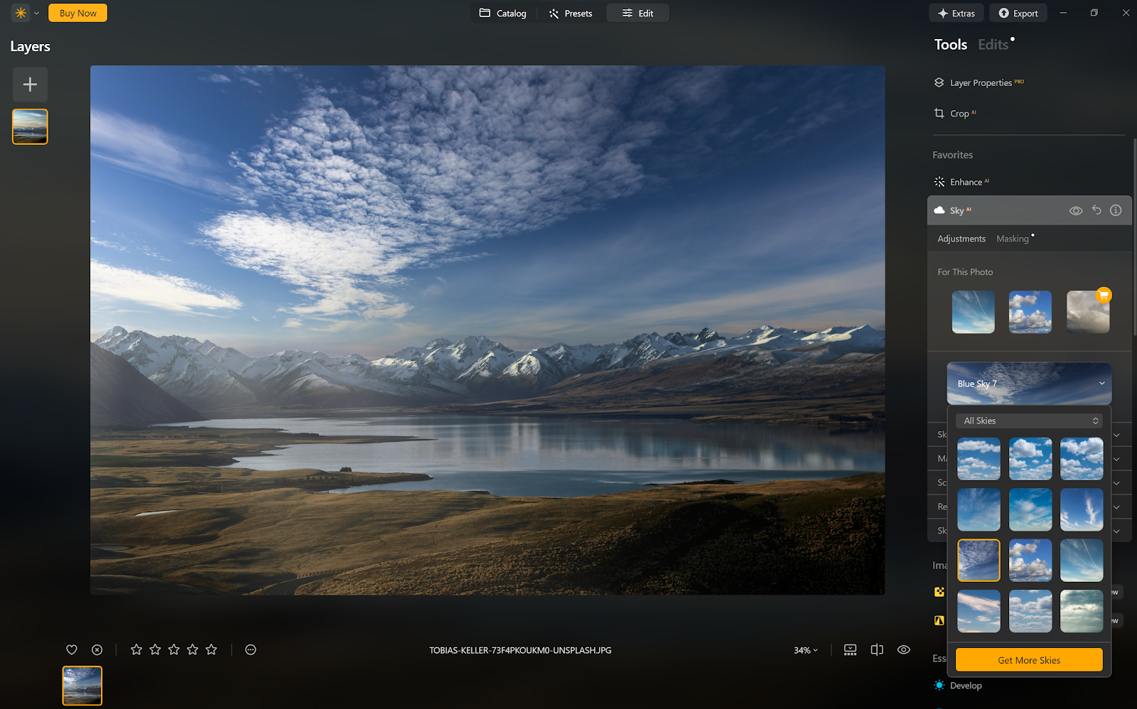 Skylum Luminar Neo interface showing an image of a snowy mountain range with the sky replaced by AI