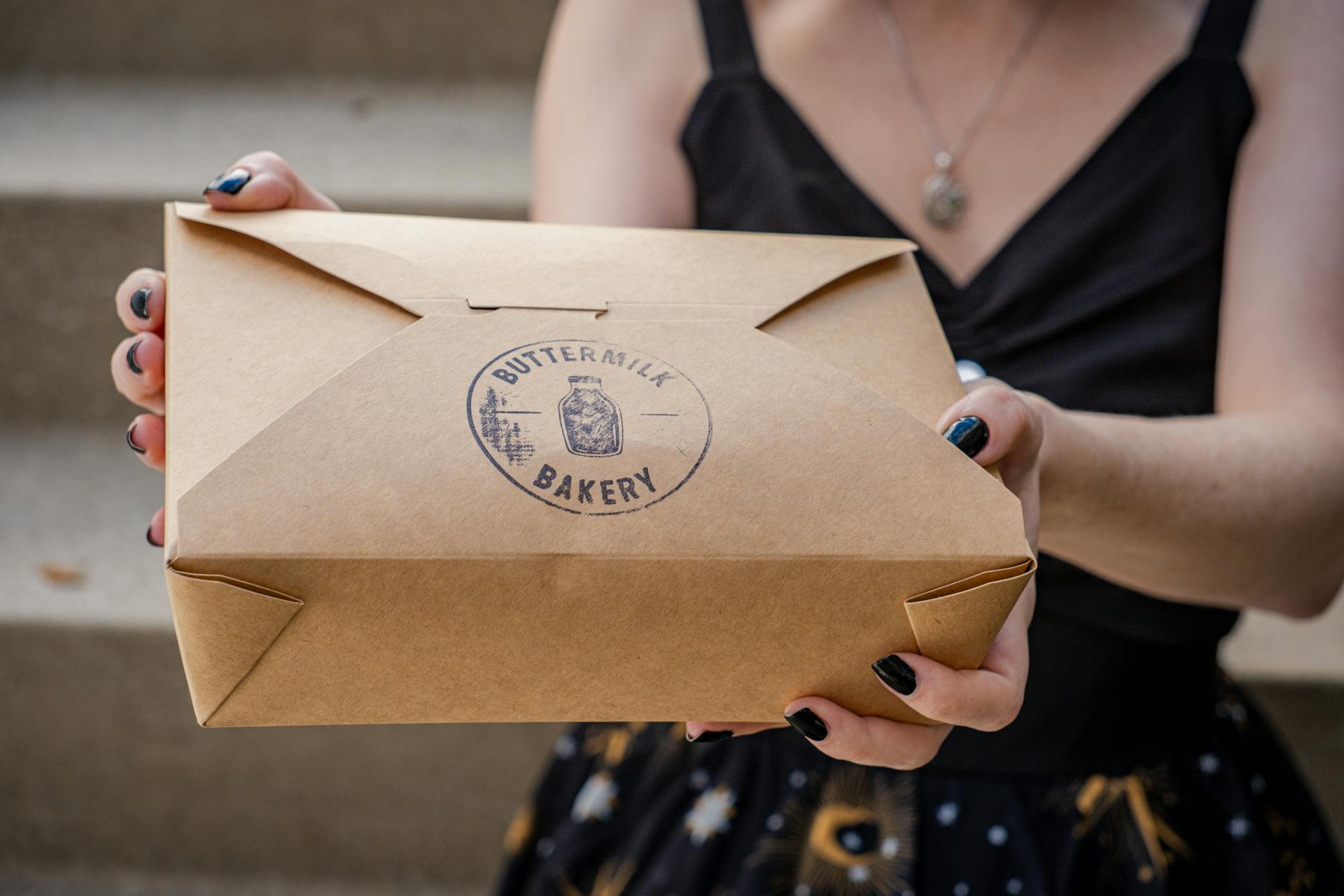 Close-up of Holding a Pastry Box
