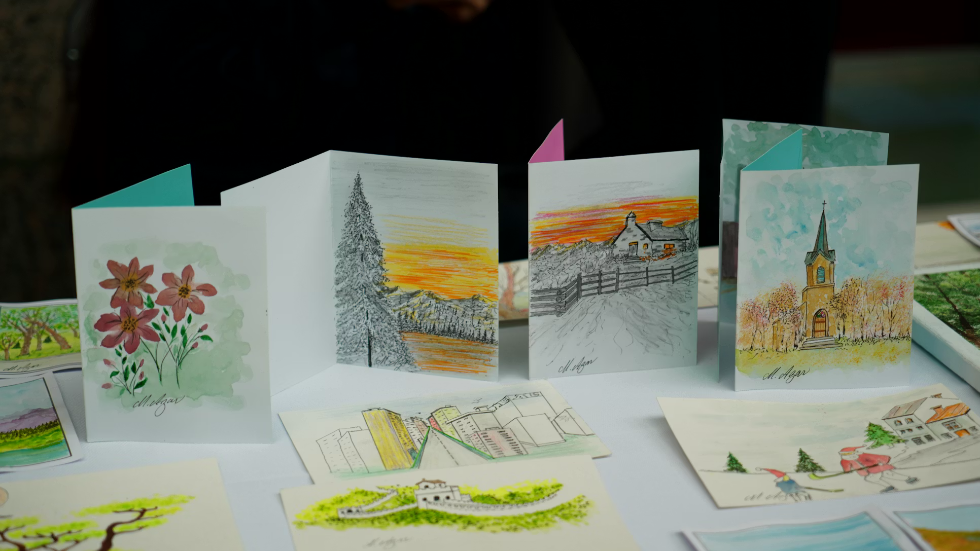 Handmade greeting cards displayed upright on a table