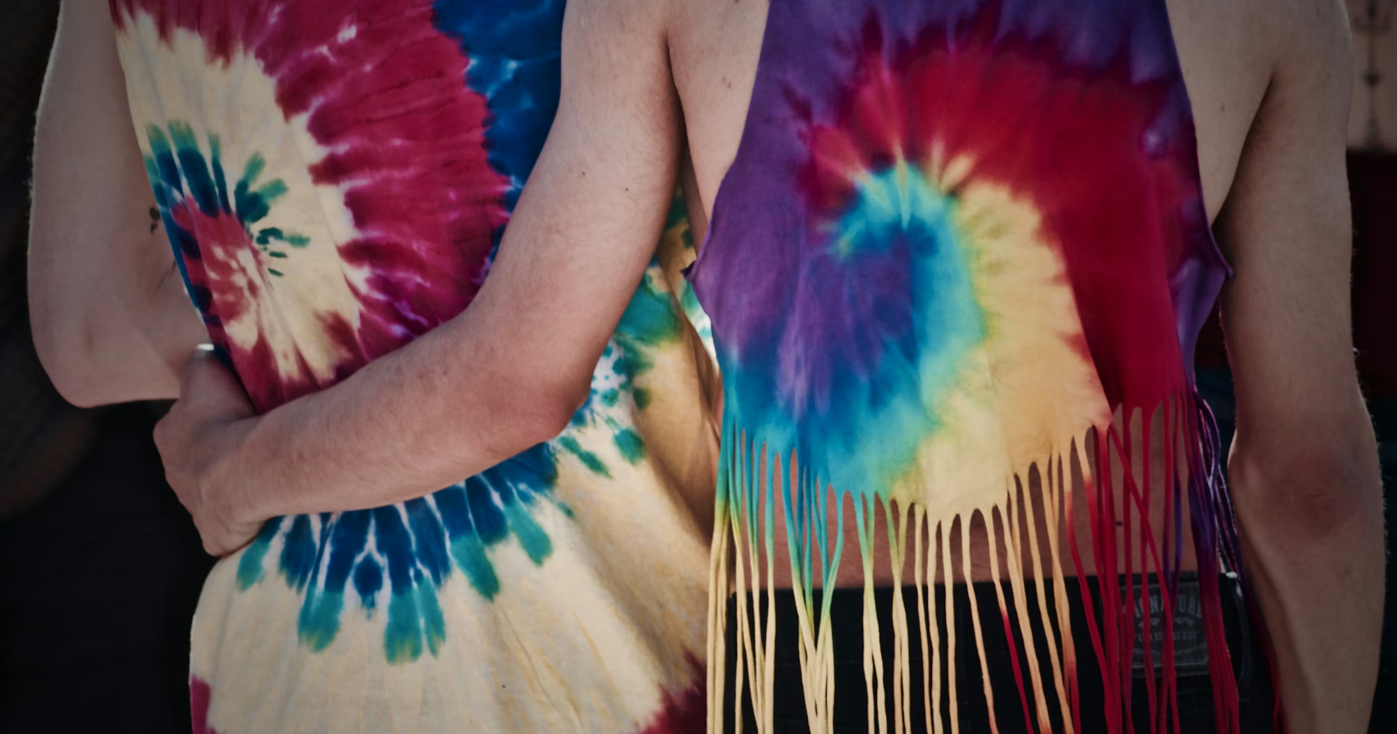 Tie-dye shirts being worn by a group of people